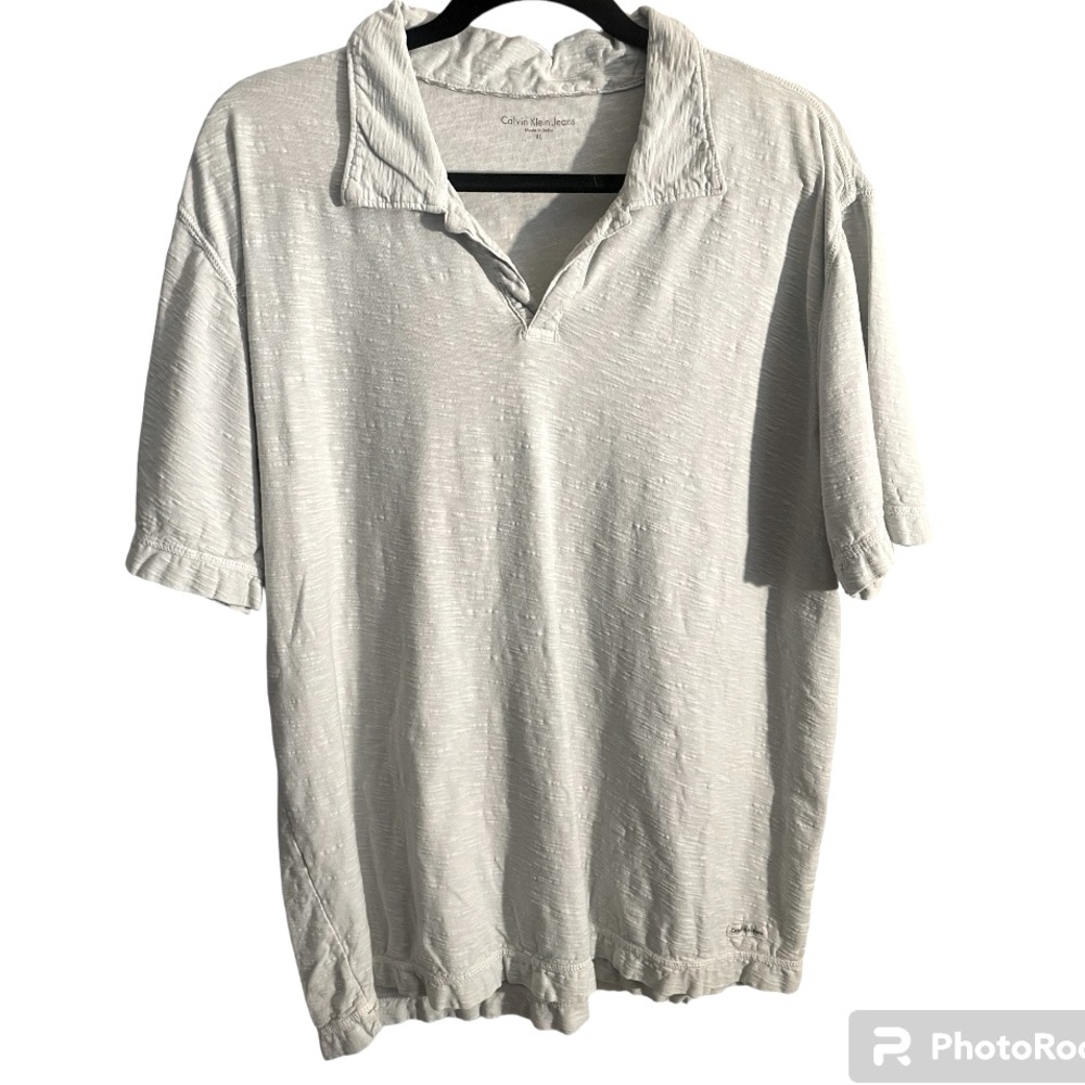 Calvin Klein Jeans brand lightweight Polo. Very light green colored w texture.